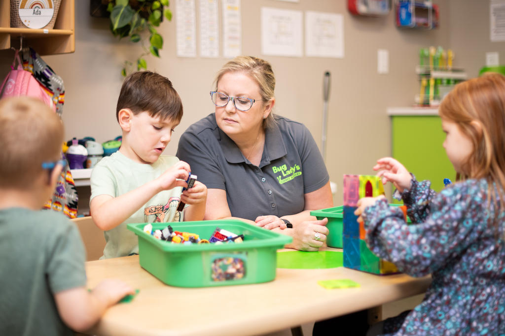 Teacher working with children