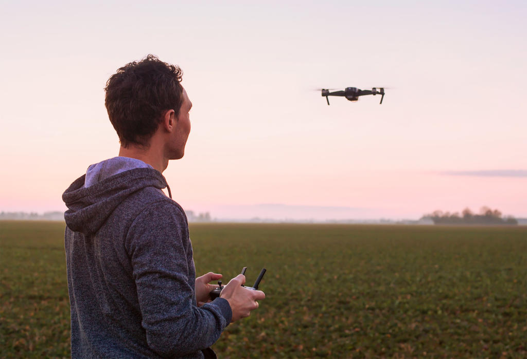 Student learning how to fly a drone under supervision