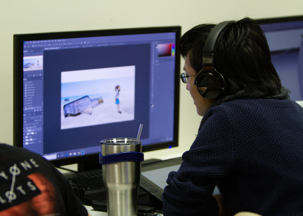 Student working in Adobe Photoshop