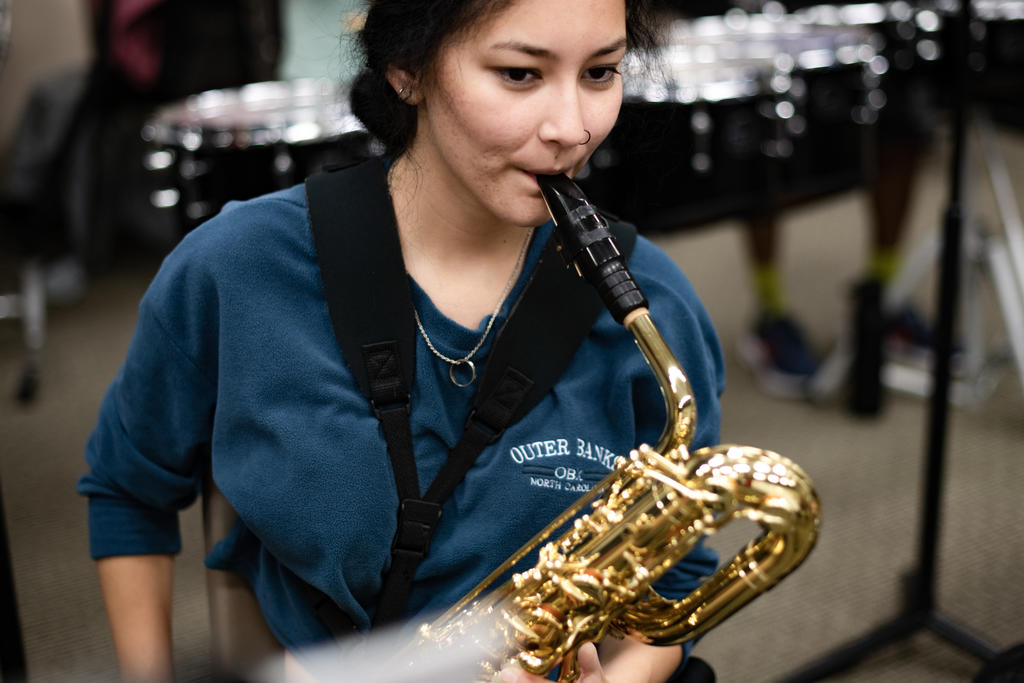 Music student playing a saxophone